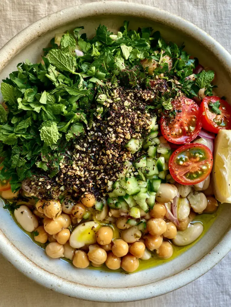 Za'atar Bean Salad with Creamy Cannellini and Crisp Persian Cucumbers 2 Glossy chickpeas and cannellini beans topped with diced cucumbers and za'atar spice. (Za'atar bean salad)