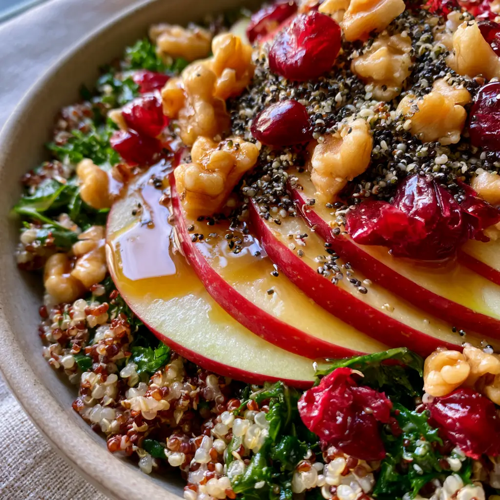Quinoa Apple Salad with Maple Balsamic Vinaigrette and Kale 2 Extreme macro close-up of quinoa apple salad showing pearlescent grains, massaged kale, and glossy maple dressing.