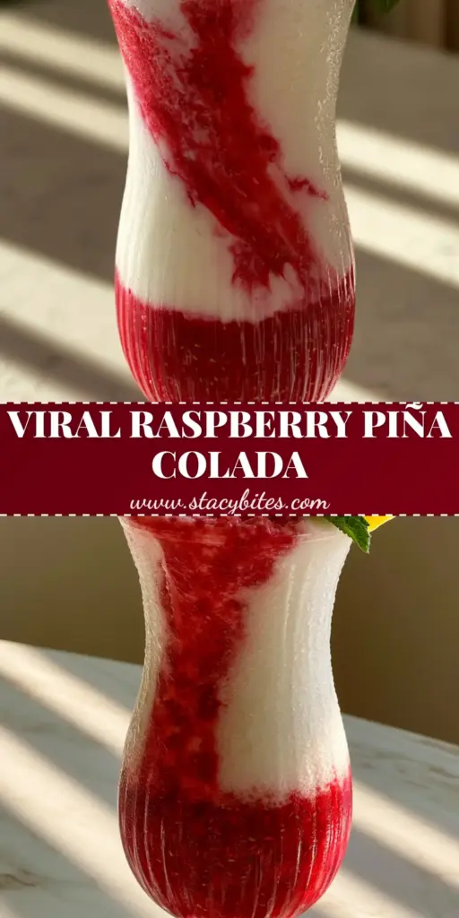 Raspberry Piña Colada: The Ultimate Layered Tropical Frozen Drink 4 A tall ribbed hurricane glass filled with a layered raspberry piña colada featuring crimson puree at the bottom and a white coconut slush on top with a mint sprig garnish.